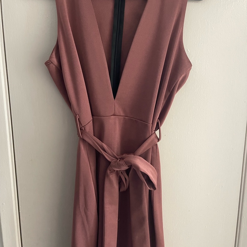 Slightly worn mini dress with deep V chest.